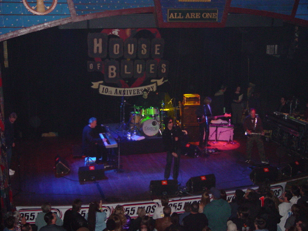 A group of people on stage at a concert.