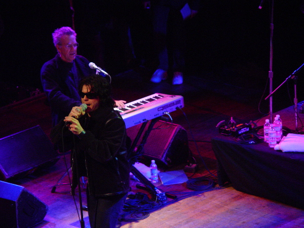 A man is singing into a microphone.