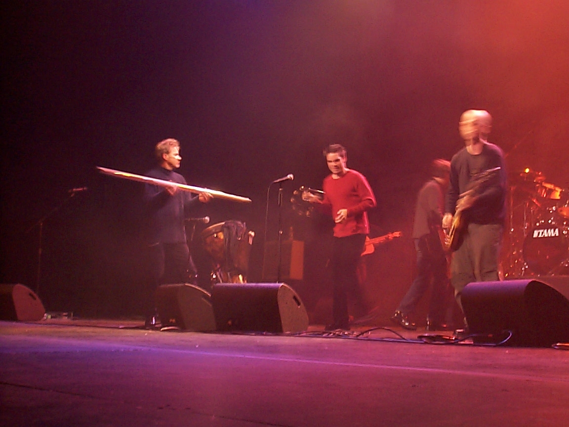 A group of people standing on a stage.