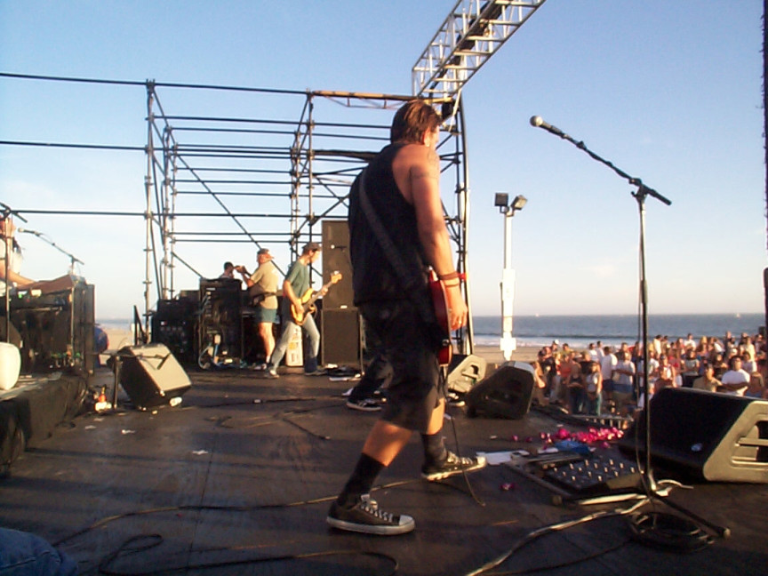 A man standing on a stage in front of a crowd.