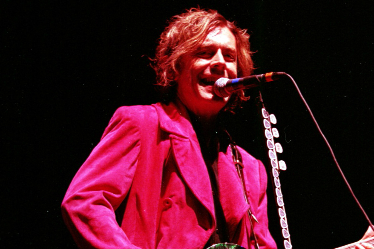 A man playing a guitar.