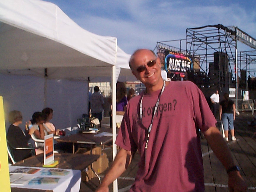 A man standing in front of a tent.