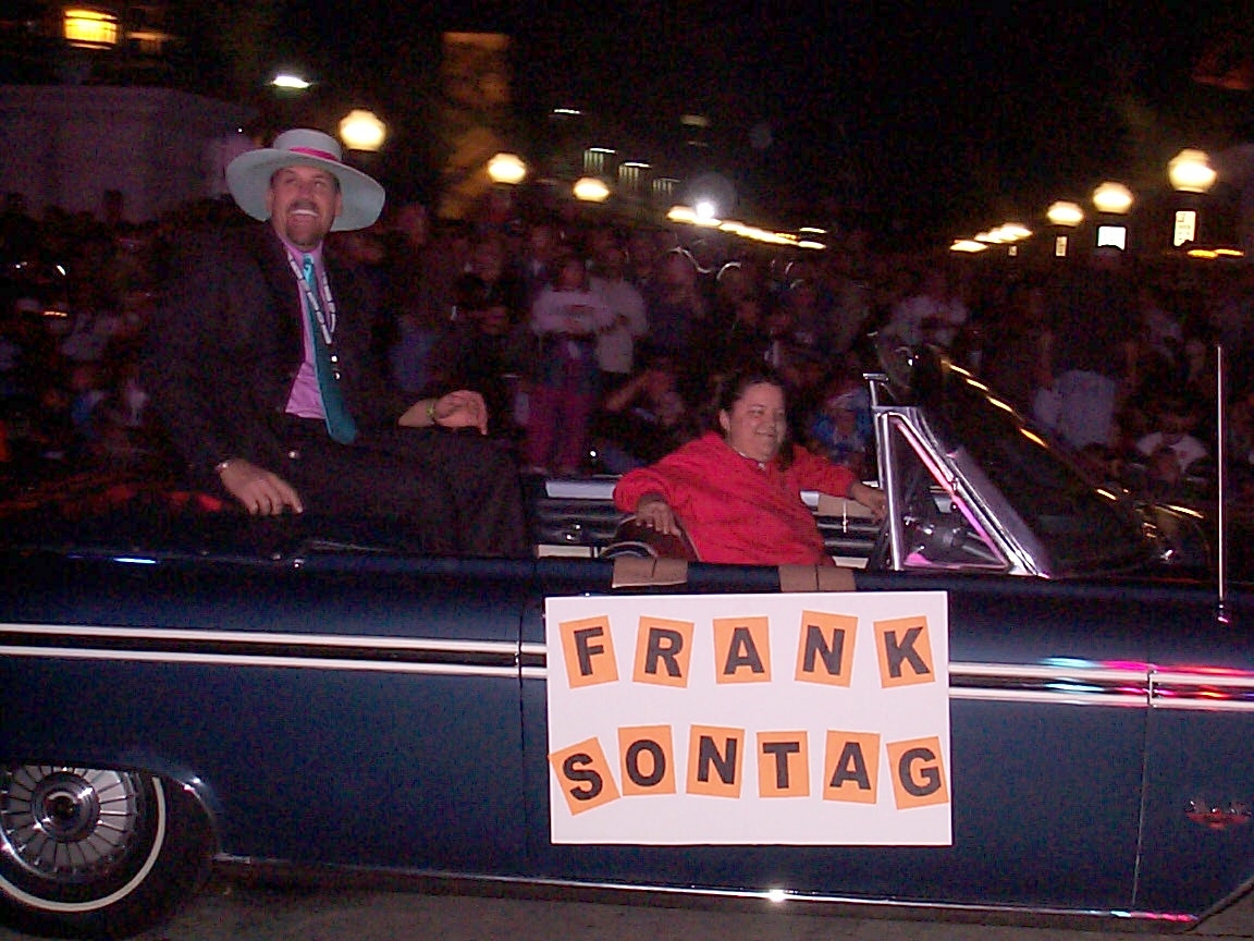 A man and woman in the back of a boat.