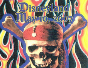 A poster of pirates of the caribbean at disneyland.