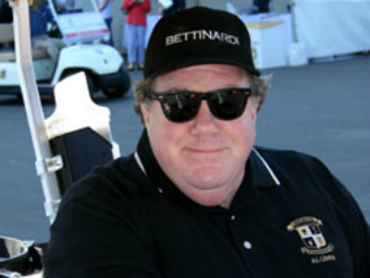 A man wearing sunglasses and a hat.