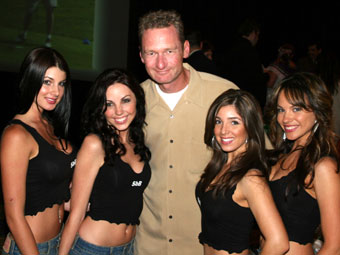 A man surrounded by four beautiful women.