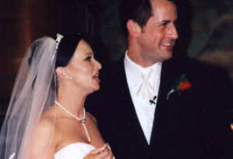 A man and woman standing next to each other.