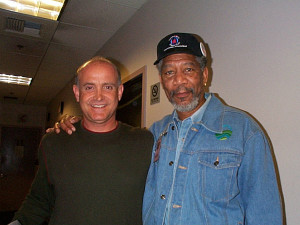 Two men standing next to each other in a room.